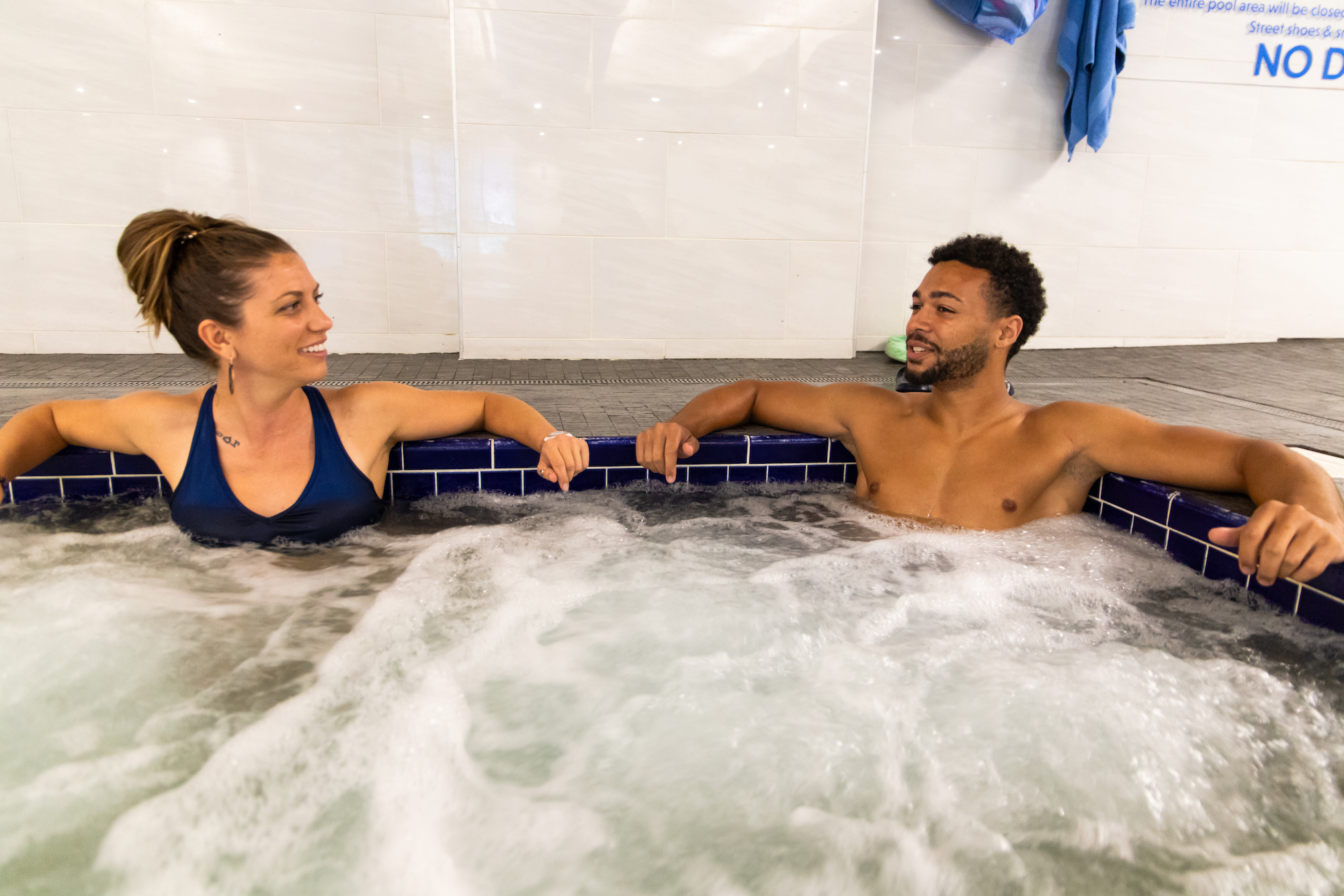 Friends in hot tub pool and spa area at gainesville health and fitness