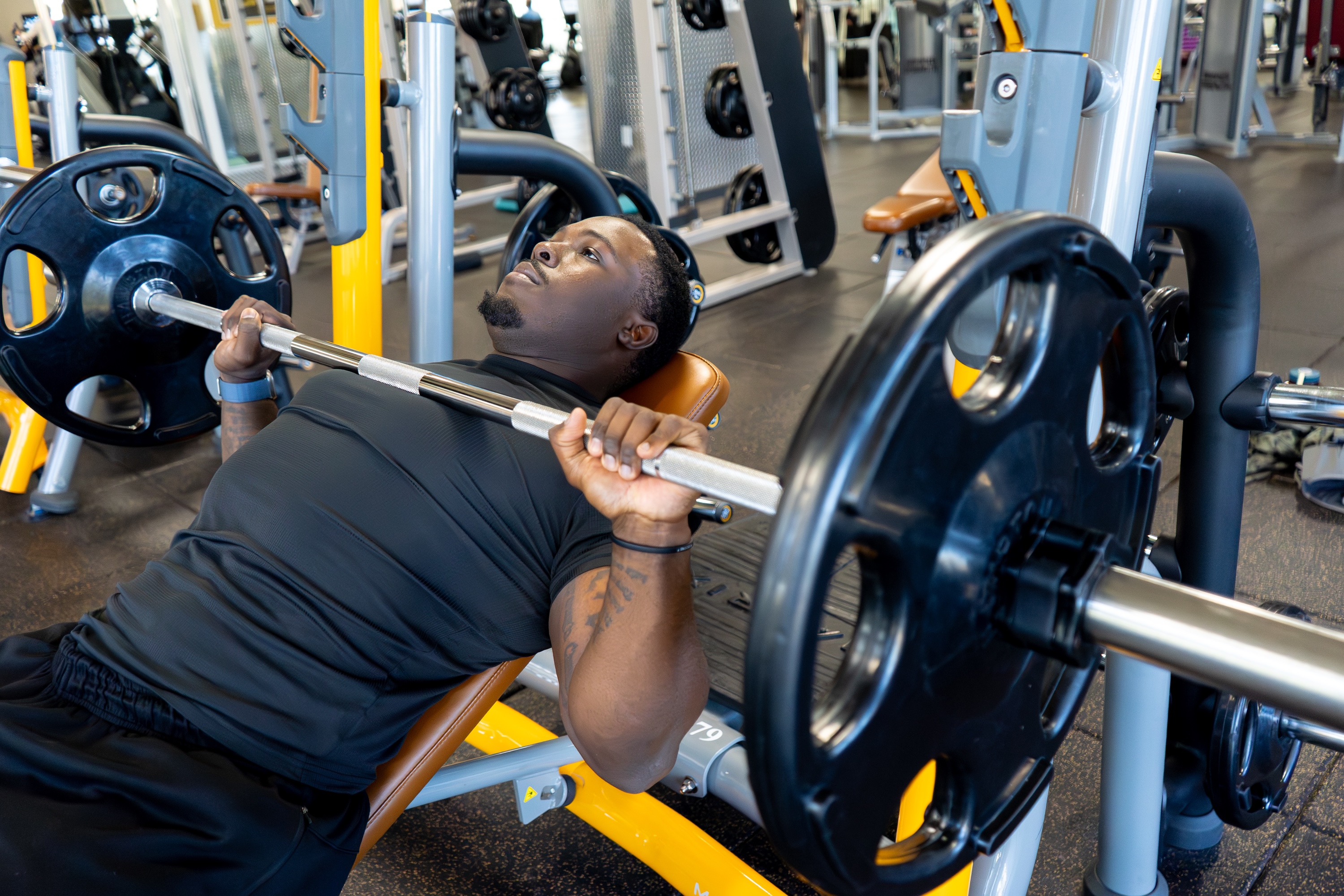 Man doing strength chest barbell workout