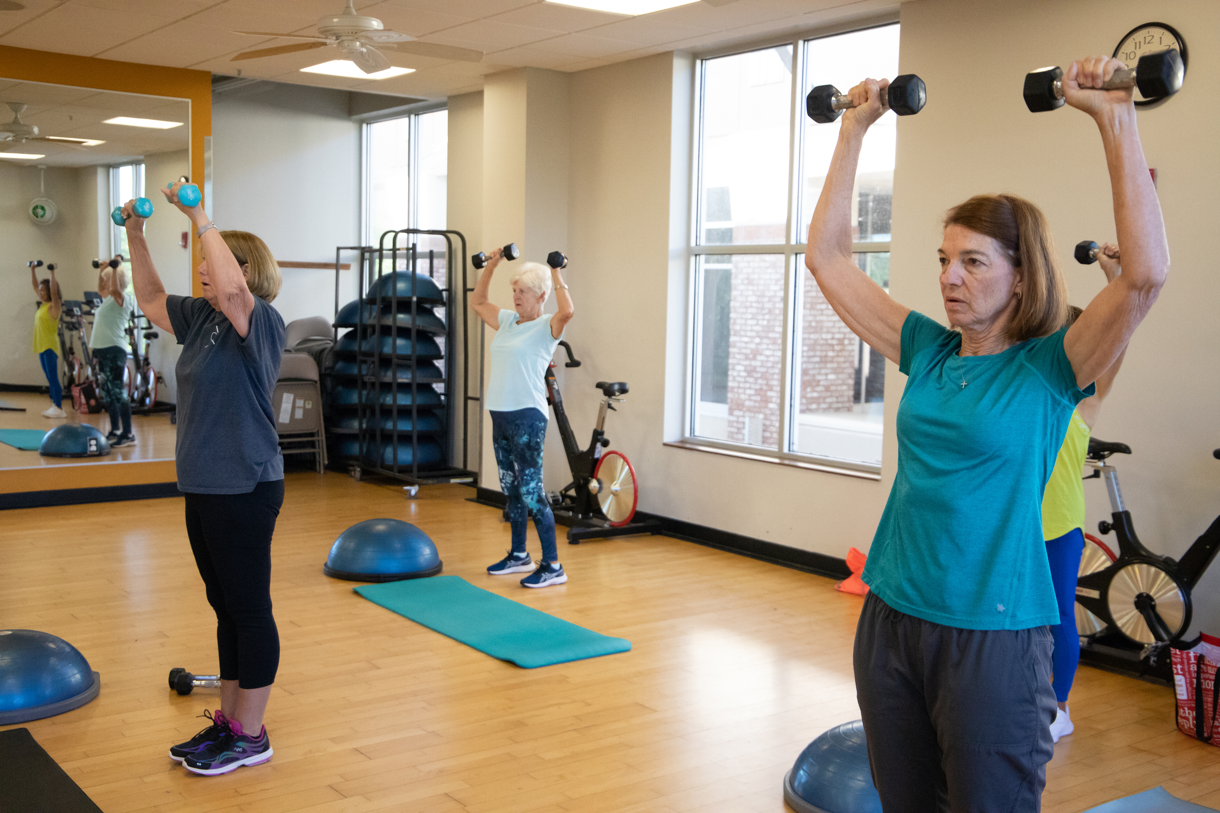 Senior GHF members in a strength group fitness class