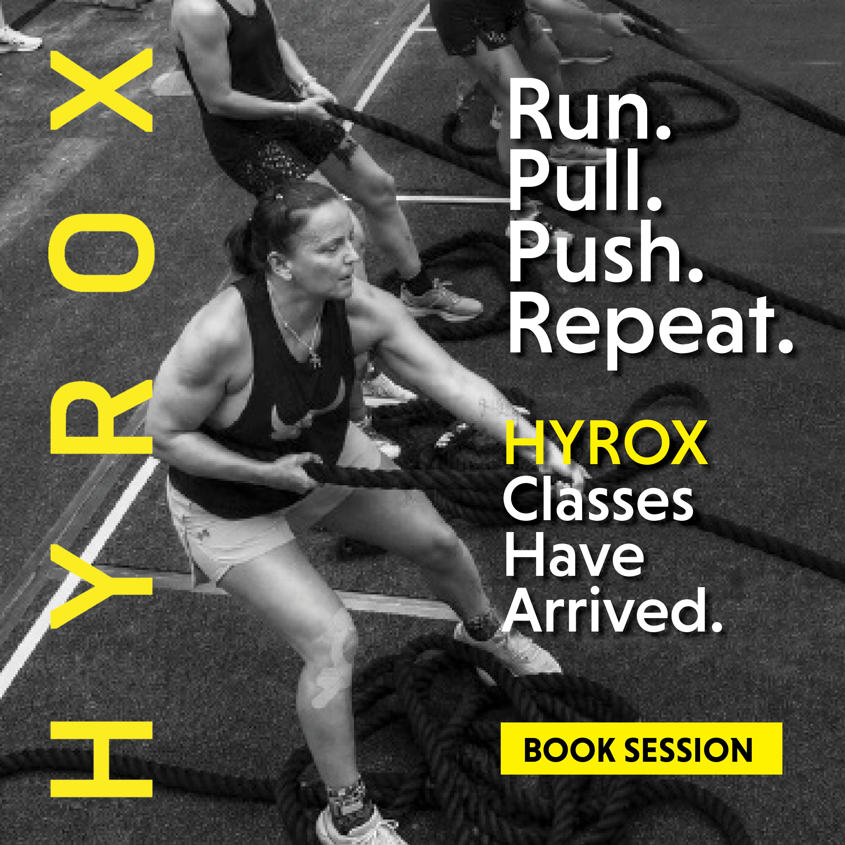 woman doing batttle rope exercise in a hyrox class at gainesville health & fitness