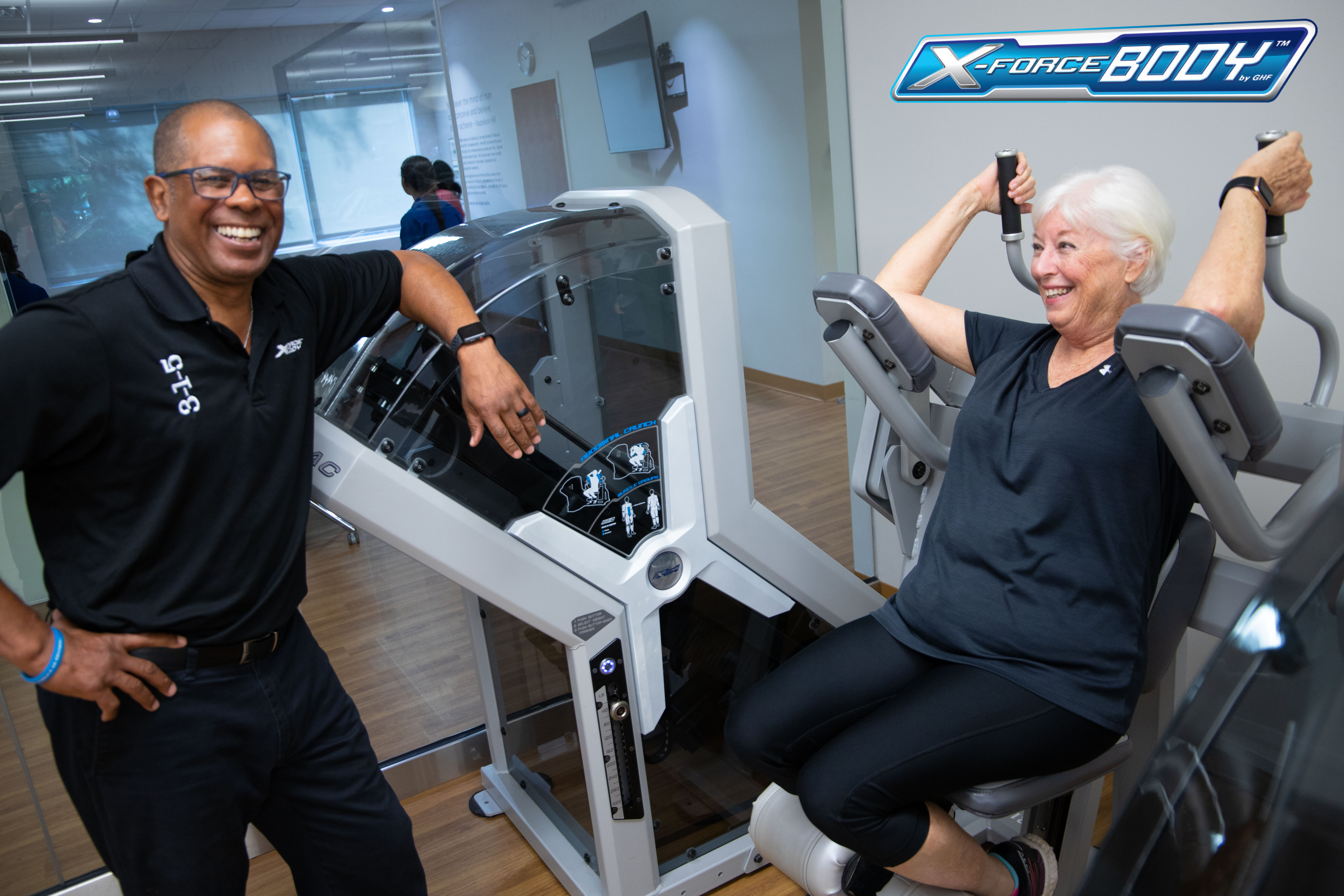X-Force Body Fat Loss at GHF Coach and client on XForce negative weight machines