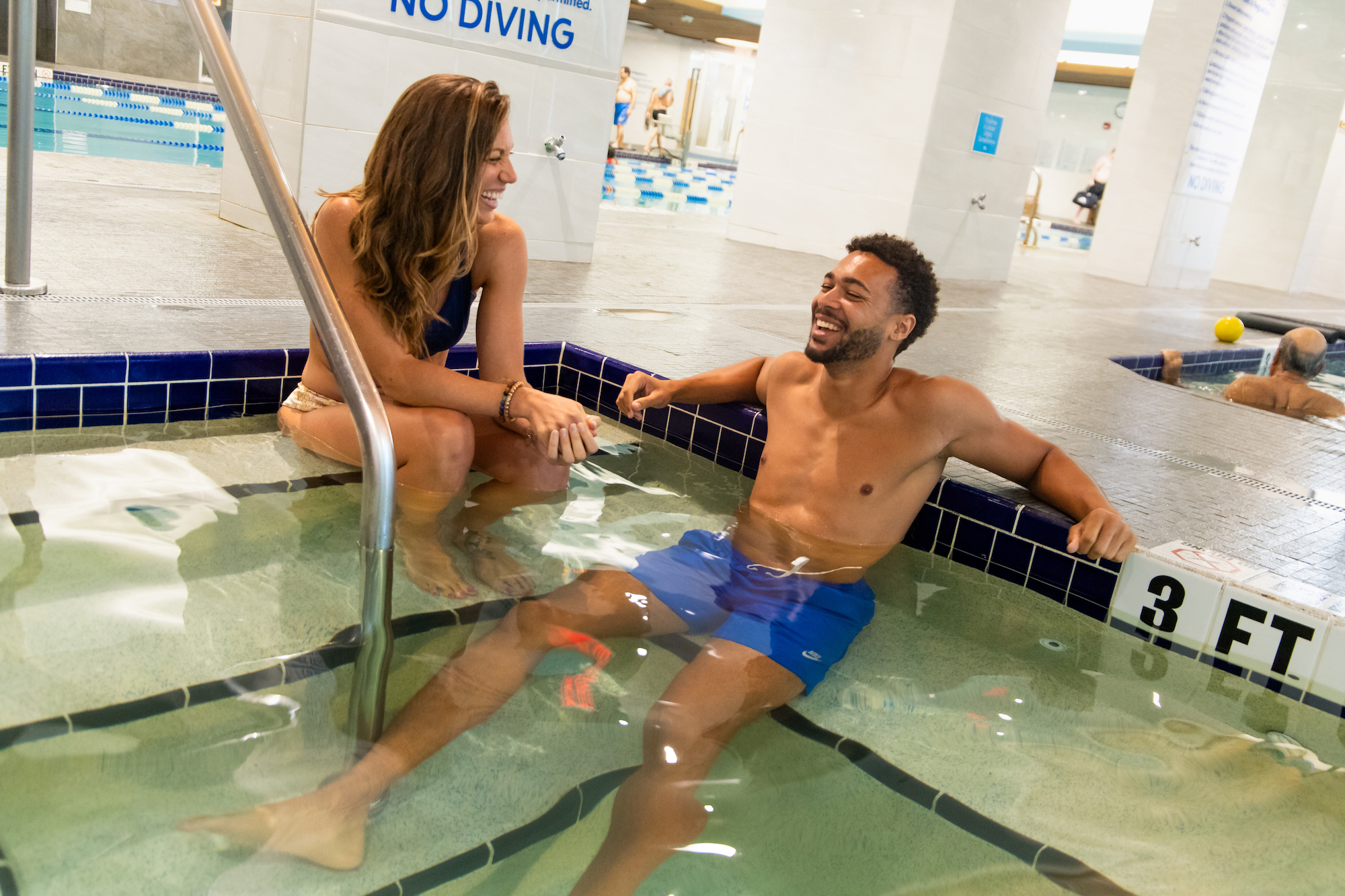 friends in indoor cold pool for cold therapy muscle recovery