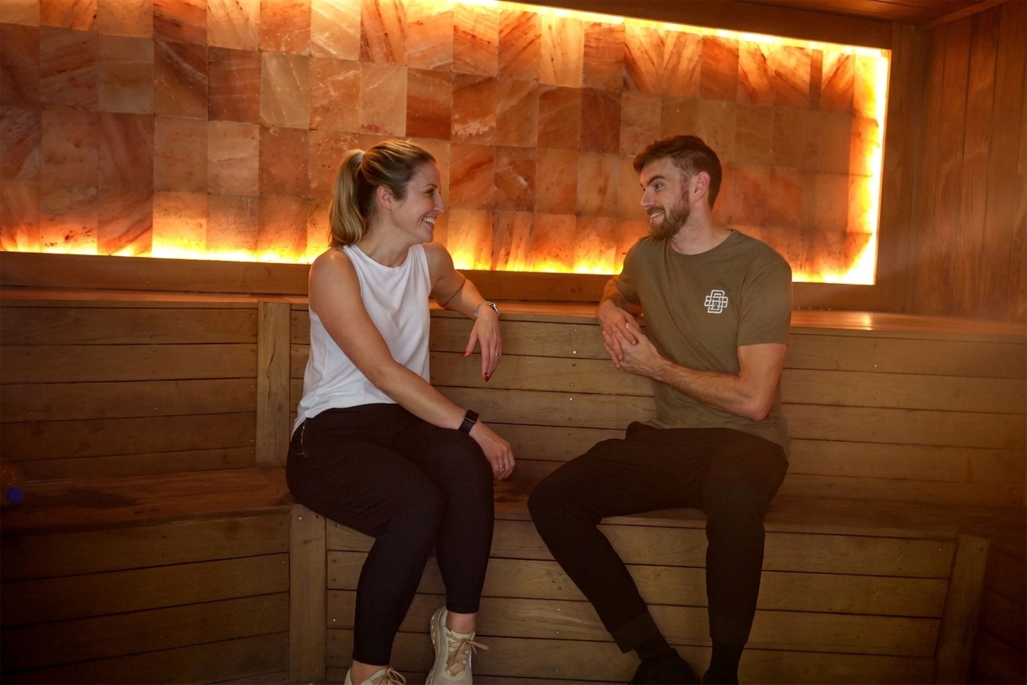 man and woman sitting in sauna at GHF Main gainesville fl
