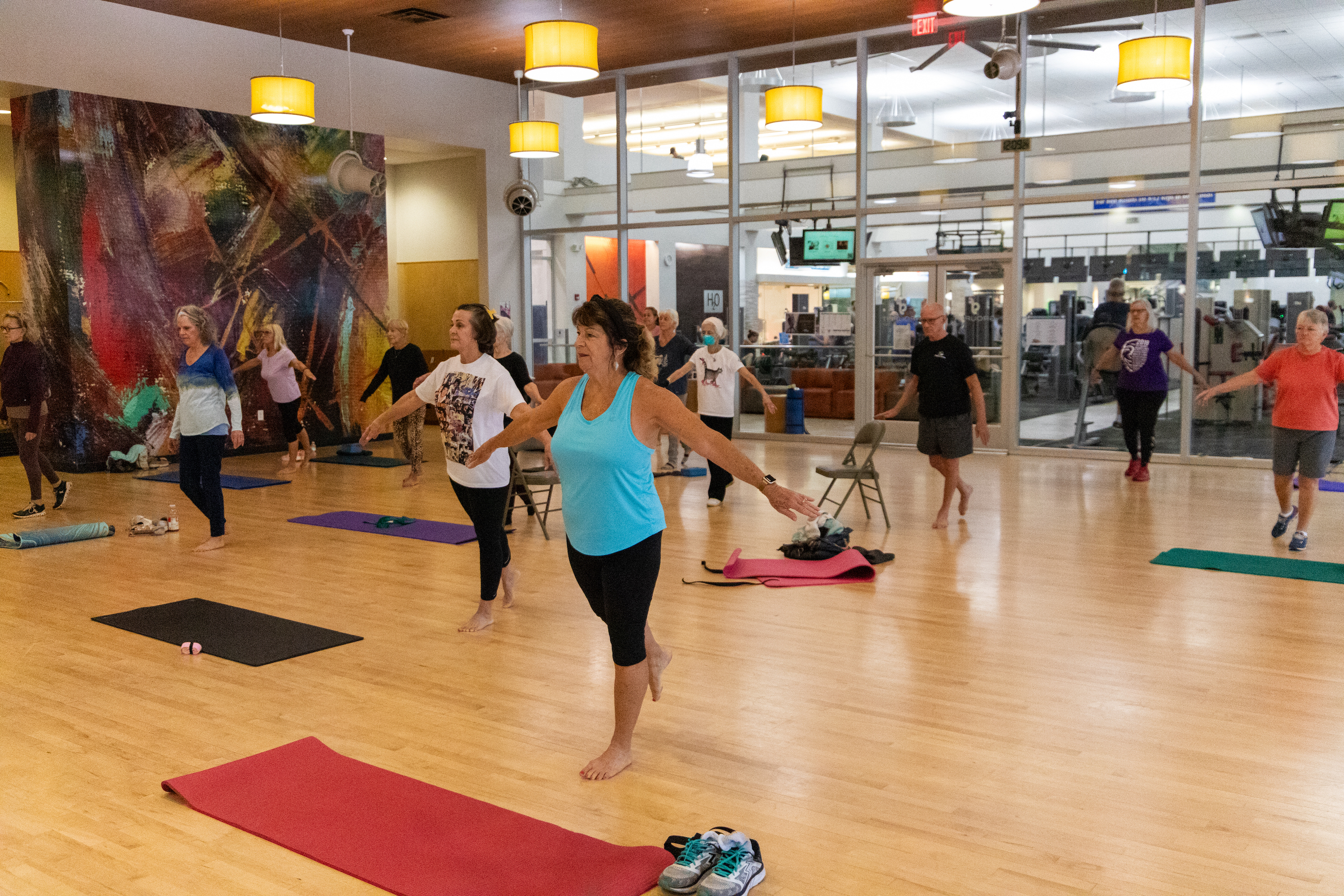 group fitness class doing a balance exercise 