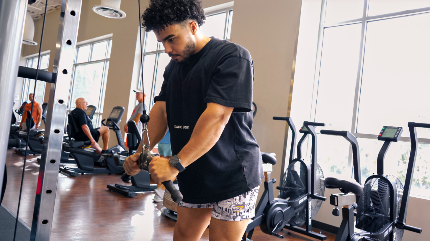 man doing a cable tricep pull down