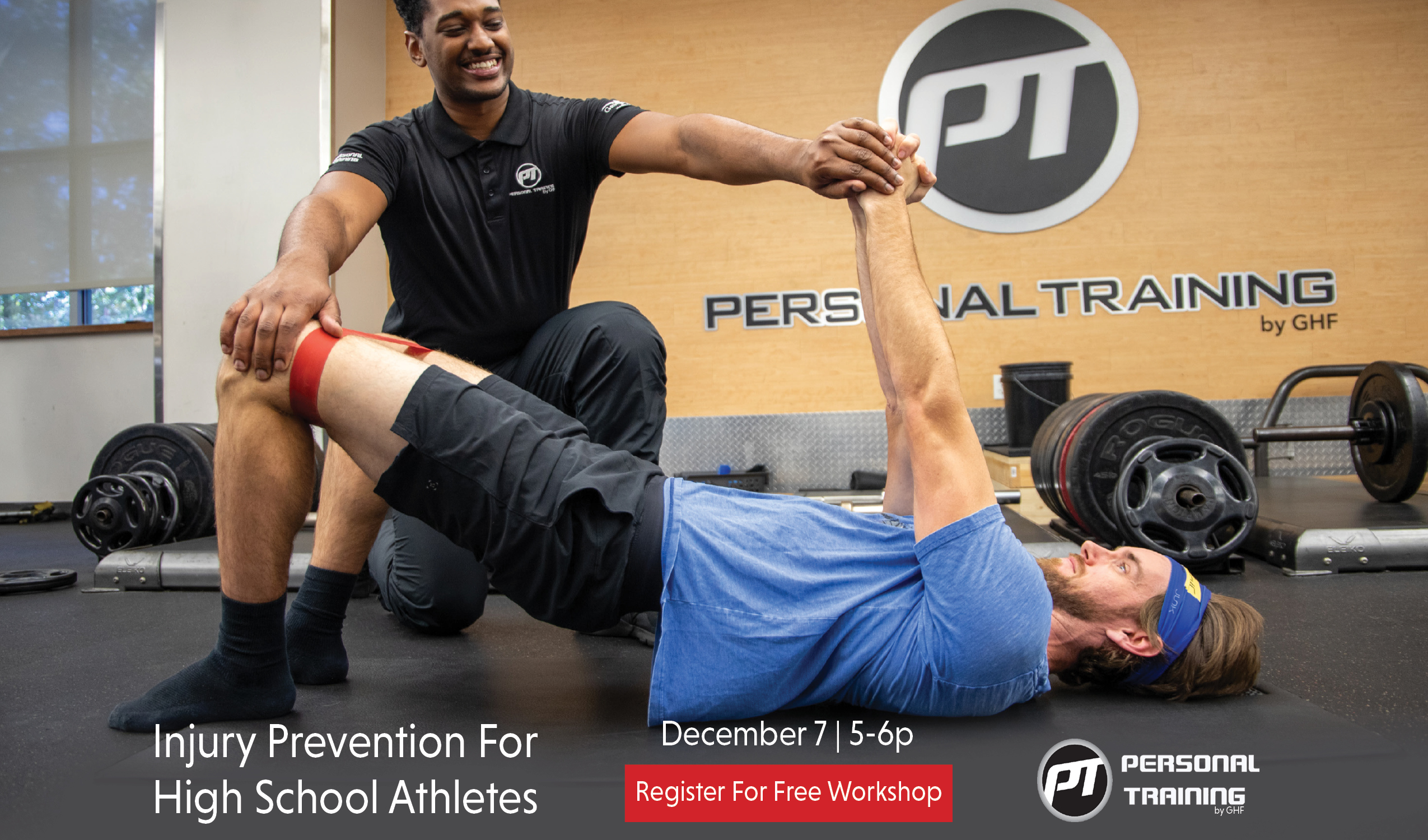 Personal trainer assisting athlete in strength exercise