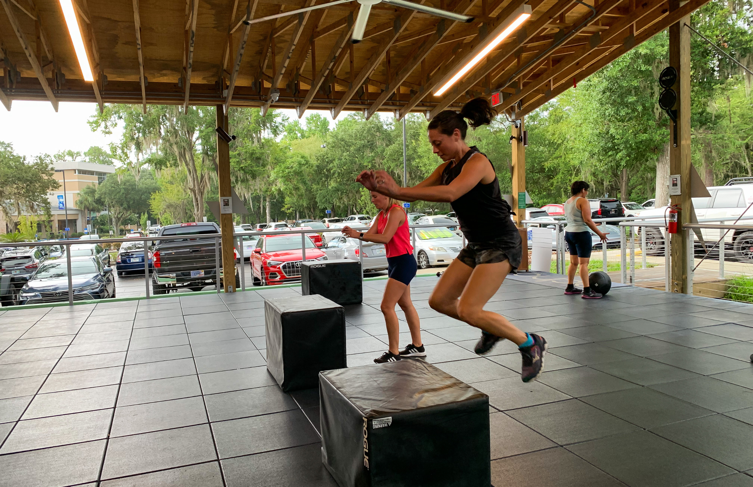 woman jumping on jump box at ghf outdoor fitness pavilion