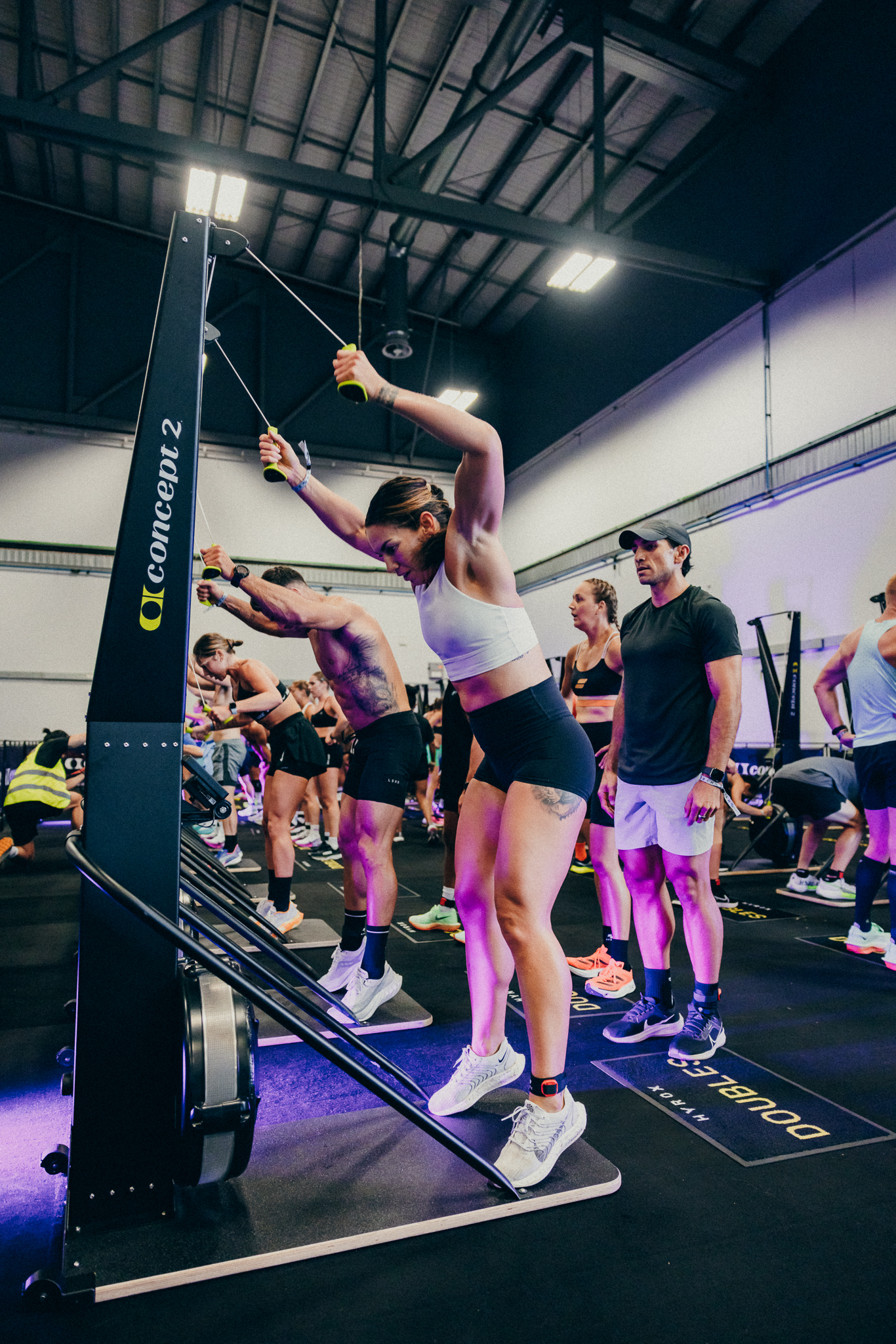 woman doing a ski erg in hyrox class at gainesville health & fitness gainesville fl