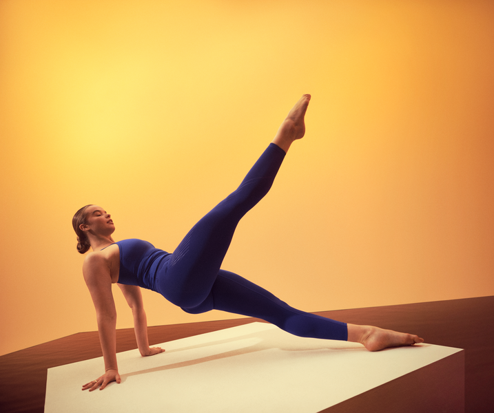 woman in a pilates mat pose