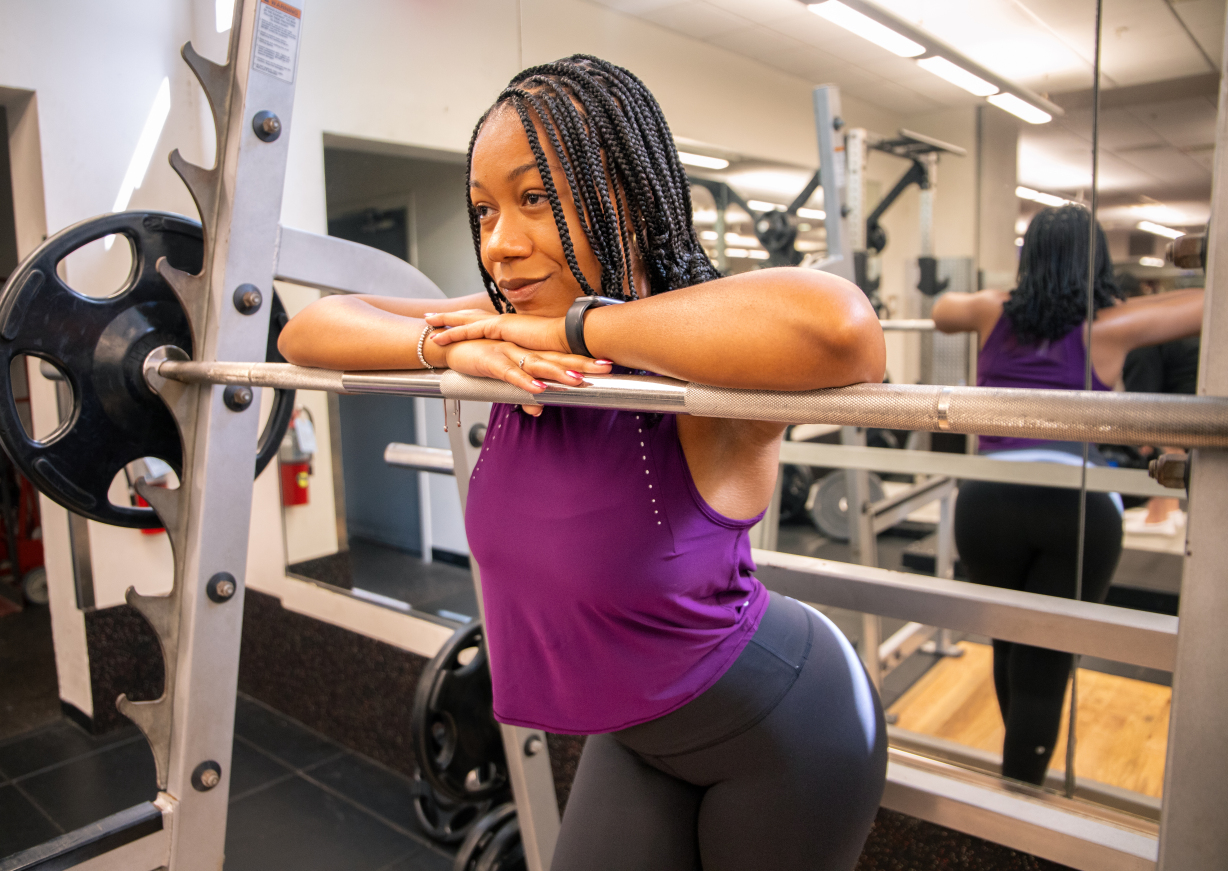 woman on squat rack in gym in gainesville fl